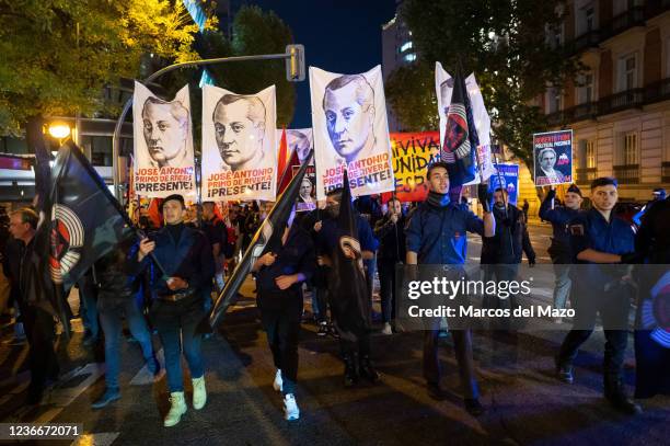 Far right wing members and supporters of La Falange carrying banners and flags during a demonstration marking the 85th anniversary of the death of...