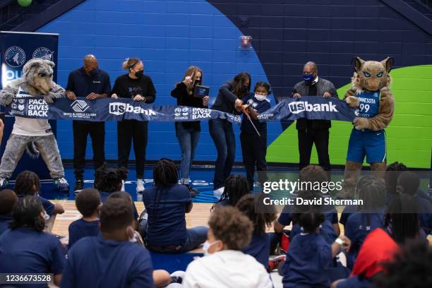 Jennifer Ridgeway, Executive Vice President of Social Responsibility, John Thomas, Vice President of Basketball Development, of the MInnesota...