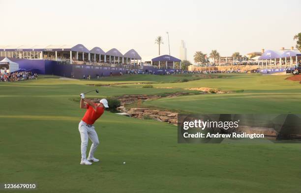 Rory McIlroy of Northern Ireland plays his second shot at the 18th hole as he finishes his round during Day Three of The DP World Tour Championship...