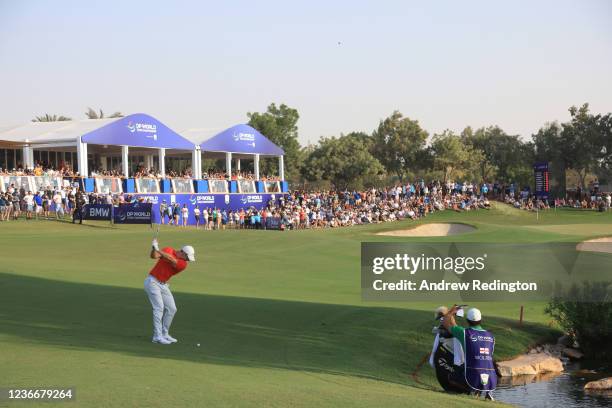 Rory McIlroy of Northern Ireland plays his third shot at the 18th hole as he finishes his round during Day Three of The DP World Tour Championship at...