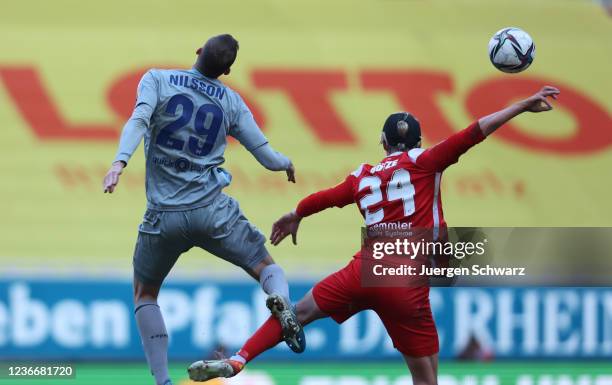 Gustaf Nilsson of Wiesbaden and Felix Goetze of Kaiserslautern battle for the ball during the 3. Liga match between 1. FC Kaiserslautern and SV Wehen...