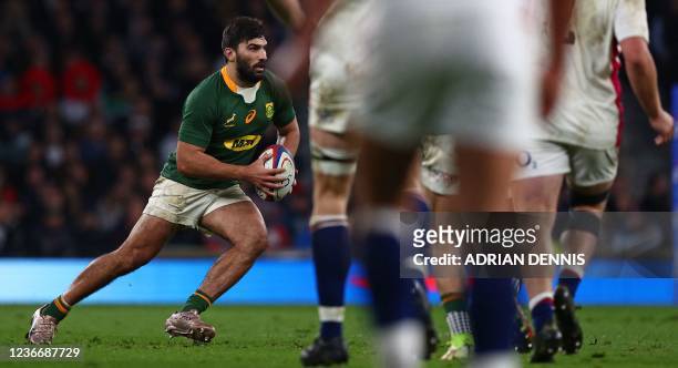 South Africa's centre Damian de Allende runs with the ball during the Autumn International friendly rugby union match between England and South...
