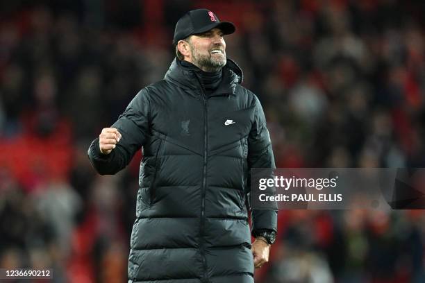 Liverpool's German manager Jurgen Klopp celebrates on the pitch after the English Premier League football match between Liverpool and Arsenal at...