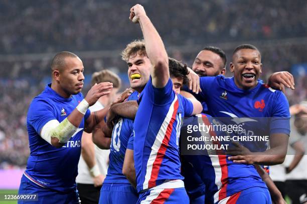 French players celebrates after France's fly-half Romain Ntamack scored a try during the Autumn Nations Series rugby union match between France and...