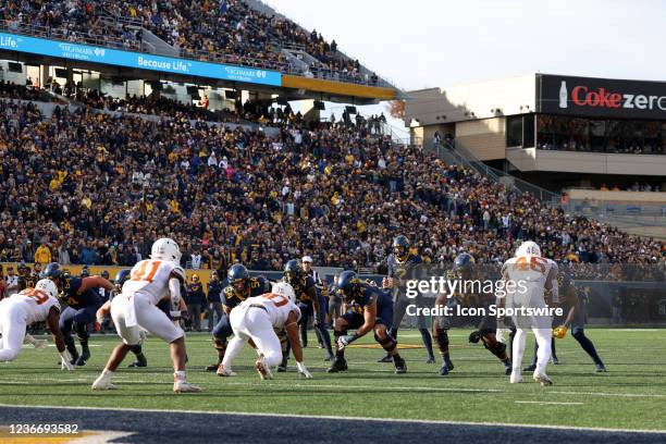 Both teams line up before a snap during a game between the West Virginia University Mountaineers and the Texas Longhorns on November 20, 2021 at...