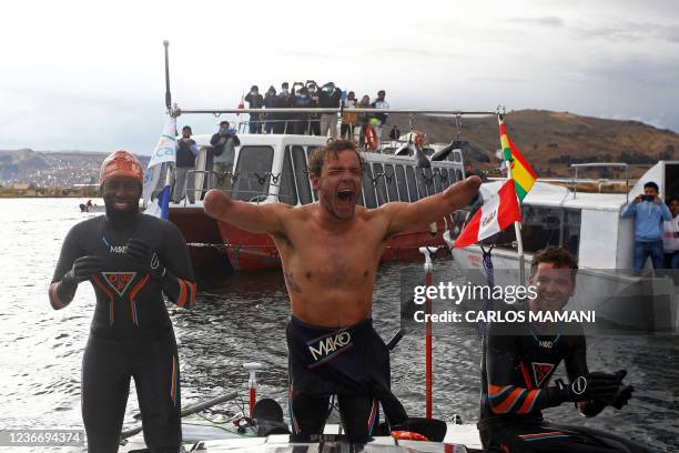 French Paralympic swimmer Theo Curin , French former Olympic swimmer Malia Metella and Matthieu Witvoet celebrate after arriving to the Uros Island...