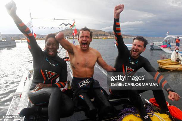 French Paralympic swimmer Theo Curin , French former Olympic swimmer Malia Metella and Matthieu Witvoet celebrate after arriving to the Uros Island...