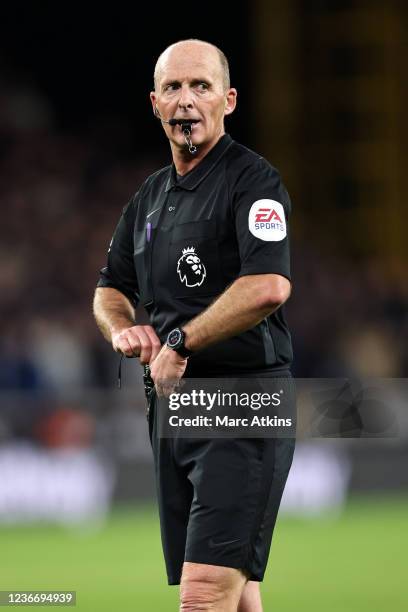 Referee Mike Dean during the Premier League match between Wolverhampton Wanderers and West Ham United at Molineux on November 20, 2021 in...