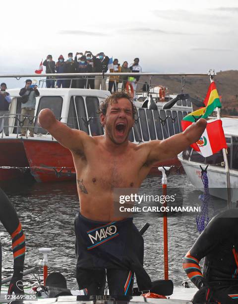 French Paralympic swimmer Theo Curin celebrates after arriving to the Uros Island in Peru, on November 20, 2021. - Paralympian quadruple amputee Theo...