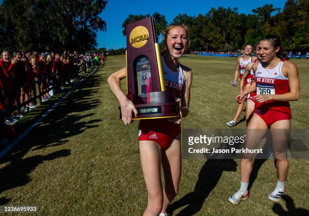 State runner Alexandra Hays celebrates after winning the Division I Womens Cross Country Team Championship held at Apalachee Regional Park on...