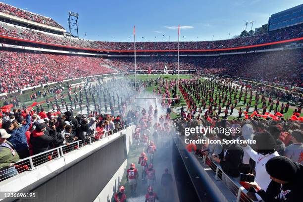 The Georgia Bulldogs run out onto the field before the start of a college football game between the Charleston Southern Buccaneers and Georgia...