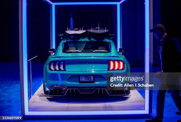 Los Angeles, CA An automotive enthusiast views the 2021 Ford Mustang Coupe premium high performance by All Star during the LA Auto Shows opening day...