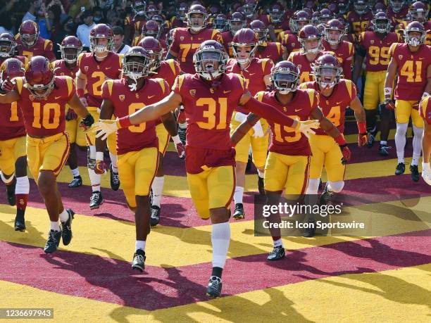 Trojans linebacker Hunter Echols leads the Trojans onto the field before the start of a college football game against the UCLA Bruins played on...