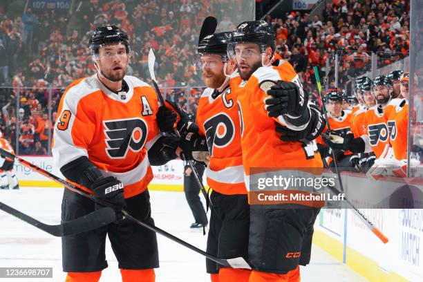 Derick Brassard of the Philadelphia Flyers celebrates with Ivan Provorov and Claude Giroux after scoring a goal against the Boston Bruins in the...