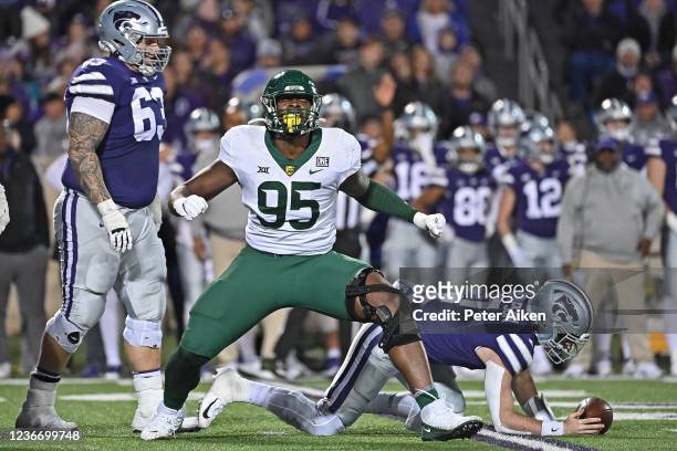 Defensive lineman Gabe Hall of the Baylor Bears celebrates after sacking quarterback Skylar Thompson of the Kansas State Wildcats, during the second...