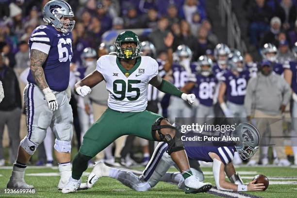 Defensive lineman Gabe Hall of the Baylor Bears celebrates after sacking quarterback Skylar Thompson of the Kansas State Wildcats, during the second...