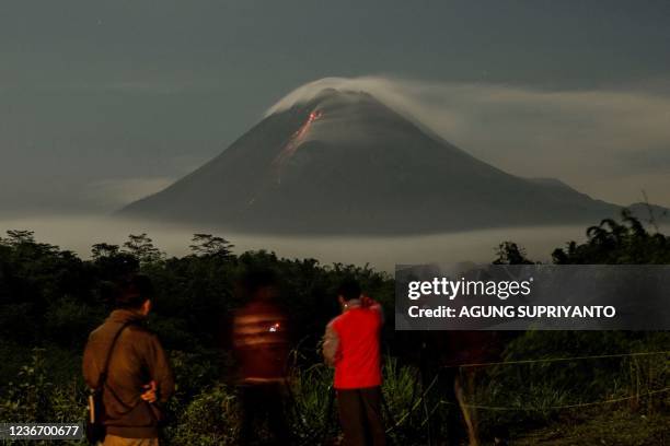 Mount Merapi, Indonesias most active volcano, spews ash and lava from its peak as seen from Sleman in Yogyakarta on November 21, 2021.