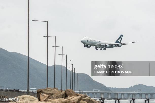 Cathay Pacific cargo airplane prepares to land at Hong Kong International Airport on November 21, 2021.