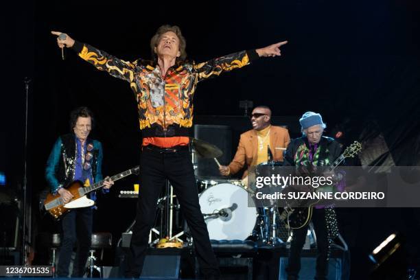 English guitarist Ron Wood , singer Mick Jagger , guitarist Keith Richards and drummer Steve Jordan of The Rolling Stones perform on stage during the...