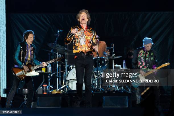 English guitarist Ron Wood, singer Mick Jagger, drummer Steve Jordan and guitarist Keith Richards of The Rolling Stones perform on stage during the...