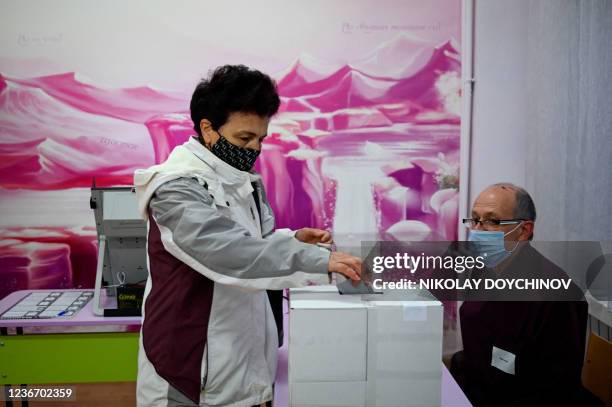 Woman votes for the second round of the presidential election at a polling station in Sofia on November 21, 2021. - Bulgarians vote on November 21,...