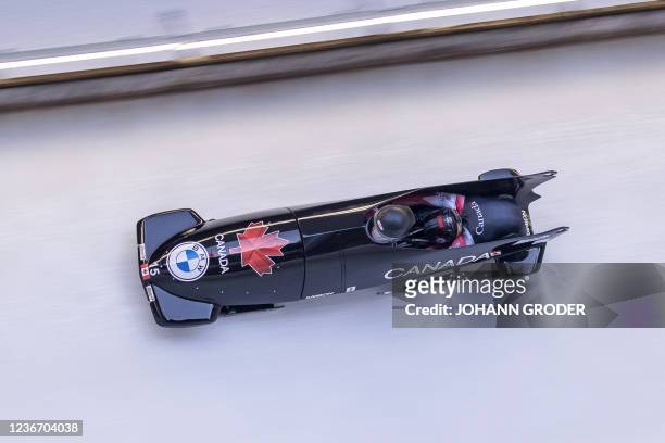 Canada's Christine de Bruin and Kristen Bujnowski compete during the first run of the women's doubles bobsleigh competition during the IBSF Bob and...