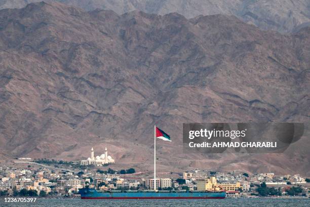 This picture taken on November 19, 2021 from Israel's southern Red Sea port and resort city of Eilat shows a view of the Flag of the Arab Revolt...