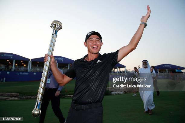 Collin Morikawa of United States with The DP World Tour Championship trophy at the 18th green as he wins The DP World Tour Championship and The Race...