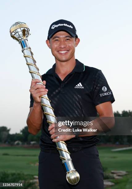 Collin Morikawa of United States with The DP World Tour Championship trophy at the 18th green as he wins The DP World Tour Championship and The Race...