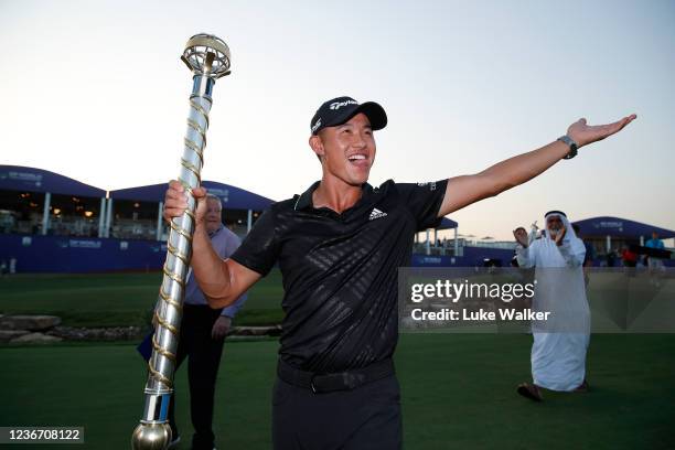 Collin Morikawa of United States with The DP World Tour Championship trophy at the 18th green as he wins The DP World Tour Championship and The Race...