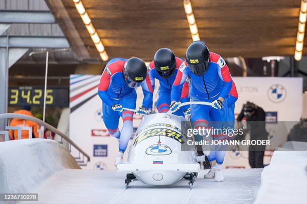 Russia's Maxim Andrianov, Aleksei Pushkarev, Vasiliy Kondratenko and Egor Gryaznov start for the first run of the four-man bobsleigh competition...
