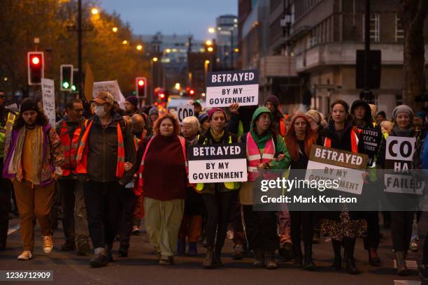 Over a hundred climate activists from groups including Extinction Rebellion and Insulate Britain march from Lambeth Bridge to Vauxhall Cross in...