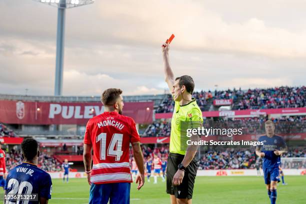 Monchu Rodriguez of Granada CF receives a red card from referee Martinez Manuera during the La Liga Santander match between Granada v Real Madrid at...