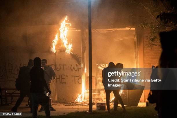 Minneapolis, MN May 29: Agitators set the Wells Fargo on fire near the 5th Precinct.