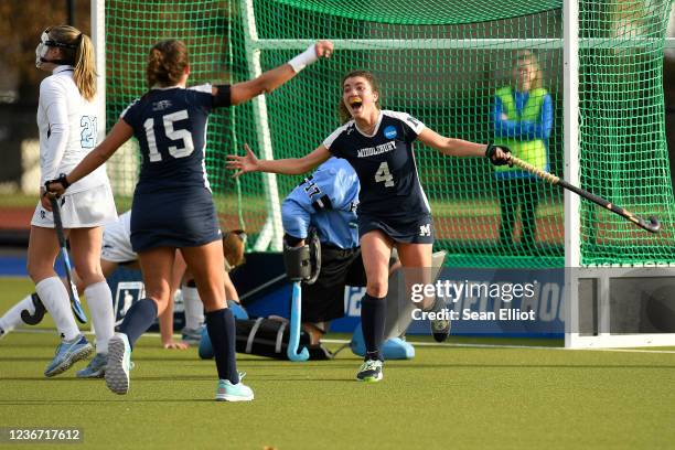 Middlebury Panthers defender Joan Vera celebrates with mid Erin Nicholas after a goal on a penalty corner against the Johns Hopkins Blue Jays during...