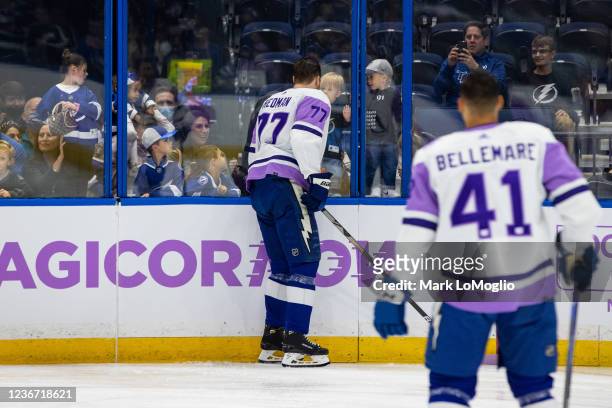 Victor Hedman of the Tampa Bay Lightning wears a special jersey for Hockey Fights Cancer Night before the game against the Minnesota Wild at Amalie...