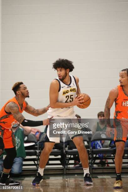 Bennie Boatwright of the Motor City looks to pass against Rayjon Tucker of the Wisconsin Herd during an NBA G-League game on November 21, 2021 at The...