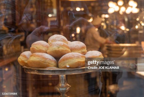 Fresh doughnuts are on display in a deli shop on the Graben, a street in the city centre of Vienna that is normally packed with crowds of people, in...