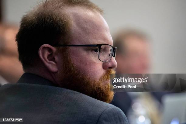 Travis McMichael sits with his attorneys before the start of closing arguments to the jury during the trial of Ahmaud Arbery's alleged killers at...