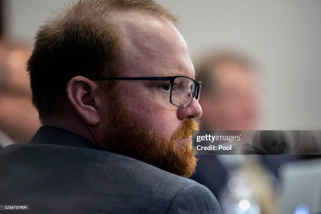 Travis McMichael sits with his attorneys before the start of closing