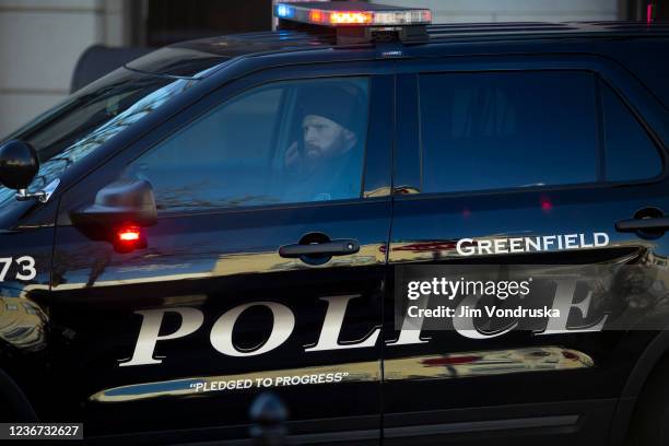 Police block off road entrances following a driver plowing into the Christmas parade on Main Street in downtown November 22, 2021 in Waukesha,...