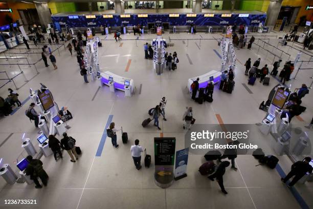 Boston, MA Passengers check-in at Terminal C at Boston Logan International Airport in Boston on November 18, 2021.