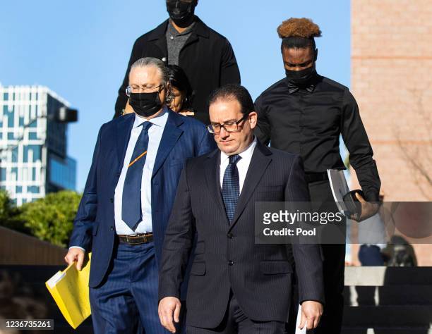 Former Las Vegas Raiders player Henry Ruggs III leaves court with his attorneys David Chesnoff and Richard Schonfeld at the Regional Justice Center...