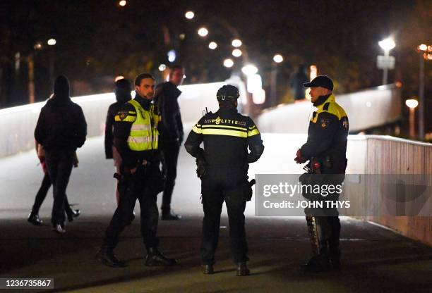 Police patrol around the centre of the Dutch northern city of Zwolle, on November 22 where an emergency order has been issued after three nights of...