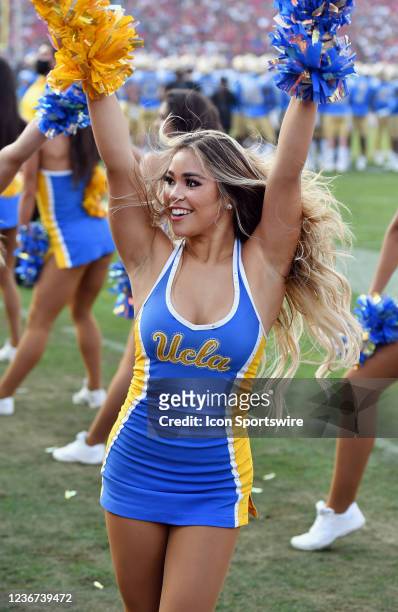 Bruins cheerleaders on the sidelines during a college football game against the USC Trojans played on November 20, 2021 at the Los Angeles Memorial...