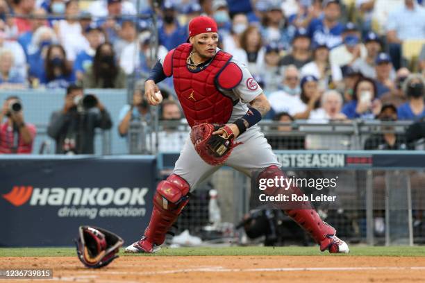 Yadier Molina of the St. Louis Cardinals fields a ball during the Wild Card game between the St. Louis Cardinals and the Los Angeles Dodgers at...