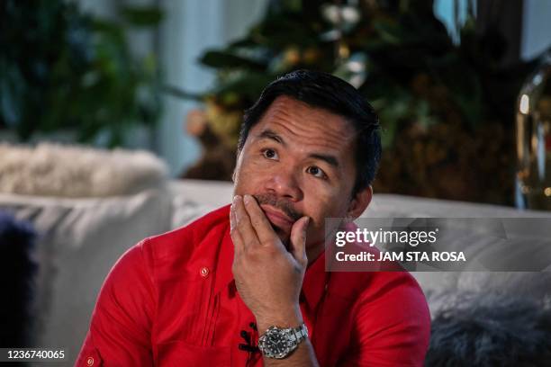 In this photo taken on November 11 Philippine Senator Manny Pacquiao gestures during an interview with AFP at his residence in Manila. - Philippines...
