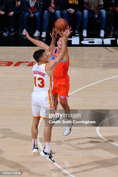 Bogdan Bogdanovic of the Atlanta Hawks shoots a three point basket against the Oklahoma City Thunder on November 22, 2021 at State Farm Arena in...