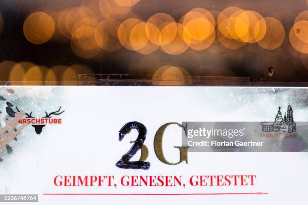Sign to point out the access with 2G is pictured in front of the christmas market at the Breitscheidplatz on November 23, 2021 in Berlin, Germany.