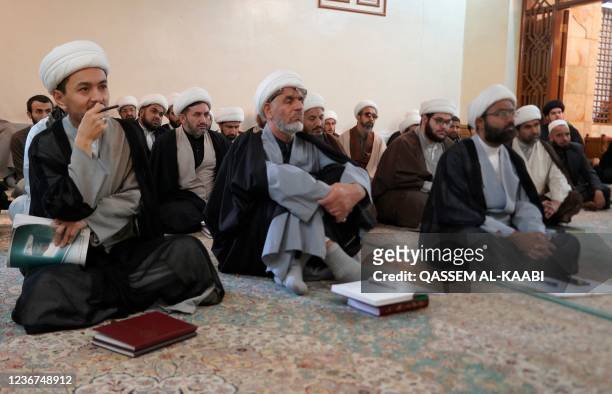 Shiite clerics listen to their teacher in Iraq's central holy shrine city of Najaf as religious schools reopen after more than two years amid the...